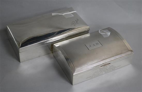 Two large silver cigarette boxes, variously inscribed, one engine-turned